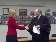Commissioner Wheeler being sworn in by Judge Horner