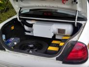 Tank in trunk of patrol car