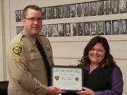 Sheriff Garton Presents Certificate of Merit to Shelby Baker