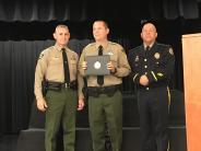 Deputy Younger accepting his certificate